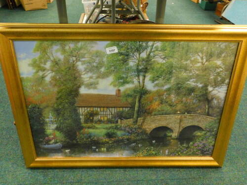 A print of a timber framed house, in a gilt frame.