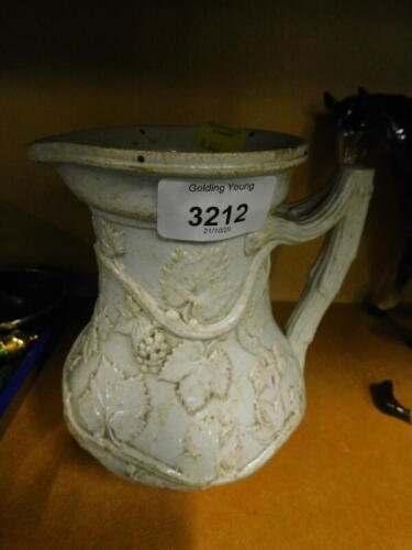 A Victorian relief moulded jug, stamped to base Society of Arts Prize Jug 1846.