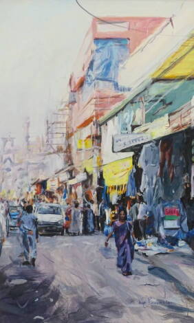 •Kim Simmens (?)(20thC). Indian street scene, oil on board, signed and dated (20)01, 87.5cm x 52cm.