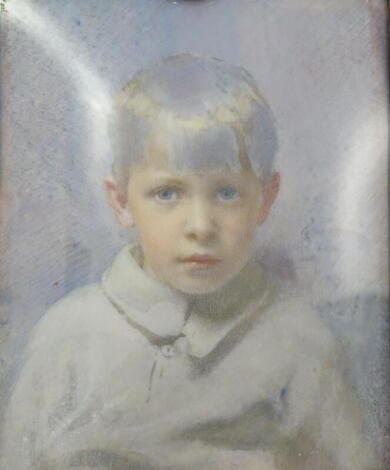 •George Scott Ingles (1874-1952) A.R.C.A. A head and shoulders portrait miniature of Alexander Rule Ingles the artist's son, circa 1910, oil on celluloid, 9cm x 7cm, in a white metal (unmarked) Arts & Crafts frame designed and made by J S Reeve, decorated