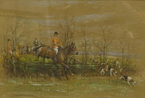 •John Sanderson Wells (1872-1955). Huntsmen and hounds taking a hedge and huntsmen and hounds entering a covert, oil pastel on brown paper, a pair, signed, 38cm x 57cm.