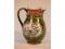 An Ashworths ironstone baluster jug with a bamboo moulded handle and spout