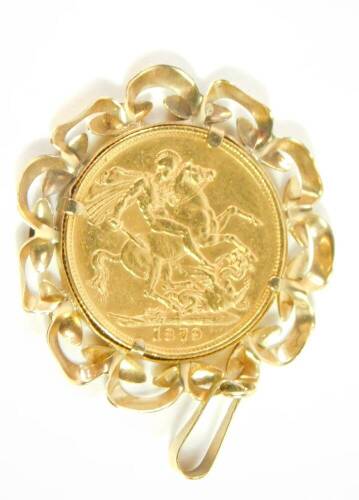 A Queen Victorian young head full gold sovereign 1879, in a yellow metal pendant mount, 10.0g all in.