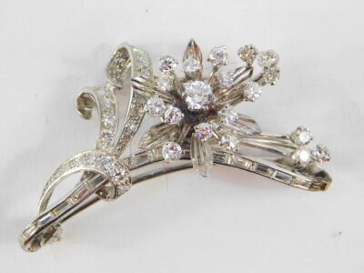 A diamond set floral spray brooch, baguette and brilliant cut diamonds, set in white metal, approximately 1.7cts, 11.7g.