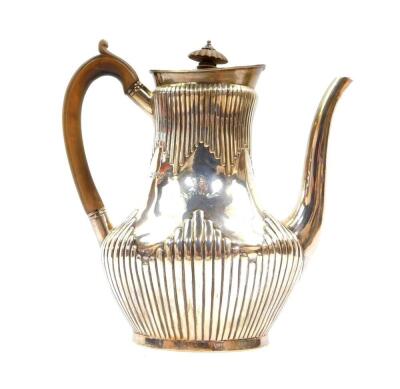 A Victorian silver fluted coffee pot, crest engraved with a demi lion rampant and motto 'Fide'., Daniel & Charles Houle, London 1880., 22.80oz.