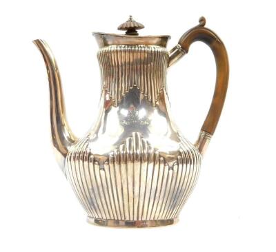 A Victorian silver fluted coffee pot, crest engraved with a demi lion rampant and motto 'Fide'., Daniel & Charles Houle, London 1880., 22.80oz. - 2