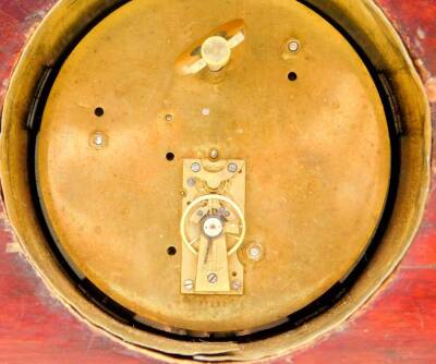 An Edwardian mahogany and inlaid mantel clock, circular dial bearing Roman numerals, clockwork movement with integral key, the case of architectural form, with brass columns, raised on brass bracket feet, 20cm high, 31cm wide, 9.5cm deep. - 4