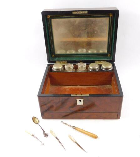 A Victorian walnut travelling box, the hinged lid opening to reveal a mirrored back and part fitted interior with five glass jars and bottles, drawer to base, with presentation plaque 'Presented to Mrs James S Holsworth by the Females Employed at the Mill