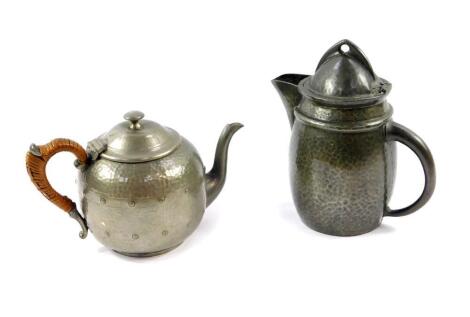 A Liberty & Co Tudric pewter jug, with a hinged lid, No 0232, impressed marks, 18.5cm high., together with a Barkers pewter teapot, with hammered and studded decoration, No 484, impressed marks. (2)