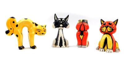 A pair of Lorna Bailey pottery seated cat and dog figures, in red and yellow, printed and painted marks, 12cm high., a seated black and white cat, 14cm high, and a yellow cat arching his back with black spots, 15cm wide. (4)