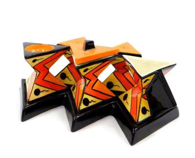 A Lorna Bailey pottery five piece condiment set, of waisted triangular form, on a five point base, printed and painted marks, 23cm wide.