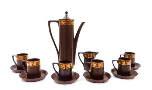 A Portmeirion part coffee service decorated in the Greek Key pattern, against a brown ground, comprising coffee pot, cream jug, six cups and saucers.