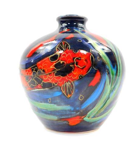 An Anita Harris art pottery vase decorated in the Thal pattern, painted with carp against a blue ground, printed and painted marks, 20cm high.