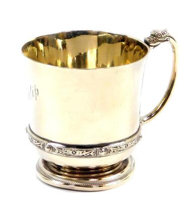 A George VI silver christening tankard, with Celtic band and dragon handle, engraved to 'Philip'., Adie Bros, Birmingham 1950., 5.24oz.