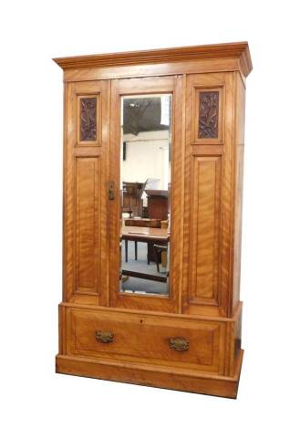 A Victorian satin walnut single wardrobe, with mirror door, and drawer base, 123cm wide.