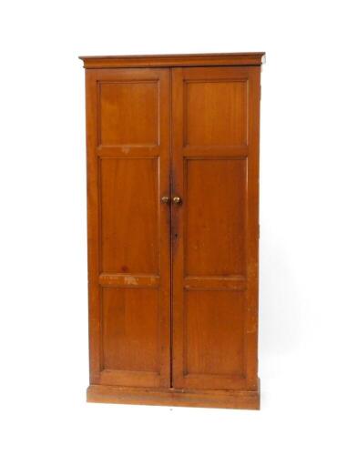 A late Victorian mahogany two door cupboard, fitted with pine stationery dividing shelves with numbered fronts, 100cm wide.