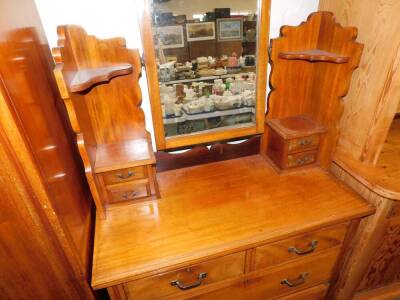 A Victorian carved walnut bedroom pair, comprising single wardrobe, with mirrored door and drawer base, 110cm wide, and dressing chest. (2) - 2