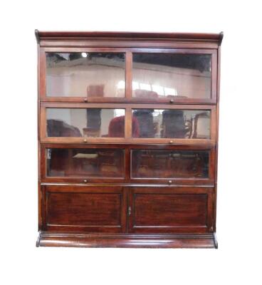 A Globe Wernicke style three section bookcase, with cupboards below, raised on a plinth base, 150cm high, 128cm wide, 35cm deep.