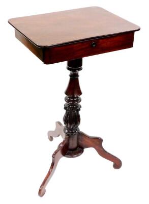 A Victorian mahogany work table, the oblong top raised above a fitted drawer on baluster column terminating in three shaped scroll feet, 78cm high, 48cm wide, 36cm deep.