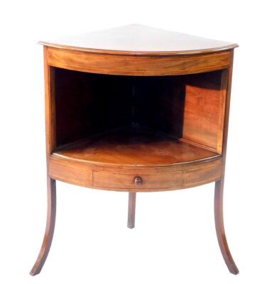 A 19thC mahogany bow front corner washstand, with plain top and drawer to centre shelf, on splay legs, 68cm wide.