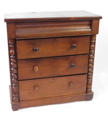 A Victorian mahogany Scotch chest, with cushion drawer over three graduated drawers with knob handles, enclosed by cut twist columns, 111cm wide.