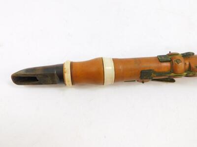 A 19thC boxwood and ivory bound clarinet by H Wrede, London, with brass keys, 58.5cm wide. - 2