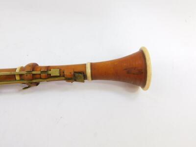 A 19thC boxwood and ivory bound clarinet by H Wrede, London, with brass keys, 58.5cm wide. - 3