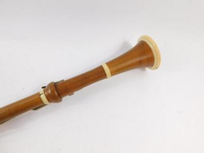 A 19thC boxwood and ivory bound clarinet by Aston & Company, London, with brass keys, 66cm wide. - 3