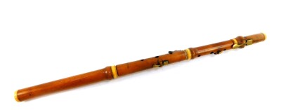 A 19thC boxwood and ivory bound flute by Metzler & Company, Great Marlborough St, London, No 37, 60.5cm wide.