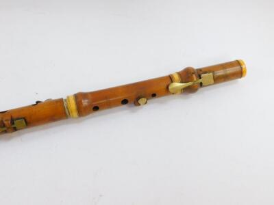 A 19thC boxwood and ivory bound flute by Metzler & Company, Great Marlborough St, London, No 37, 60.5cm wide. - 2