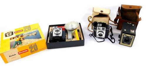 A Kodak Brownie Twin 20 camera outfit, boxed, together with a Brownie Twin 20 camera, and a Brownie Six - 20 camera, model C, both cased. (3)