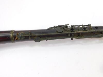 A 19thC rosewood clarinet, 67.5cm long., a rustic whistle carved with a head of a bird, and two further woodwind instruments. (4) - 2