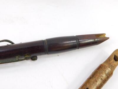 A 19thC rosewood clarinet, 67.5cm long., a rustic whistle carved with a head of a bird, and two further woodwind instruments. (4) - 3