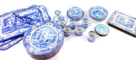 A Spode porcelain part dinner and coffee service, decorated in blue and white in the Italian pattern, comprising ten dinner plates, six fruit bowls, six coffee cans and saucers, four tea plates, a candlestick, six place mats, four coasters, ten napkins an