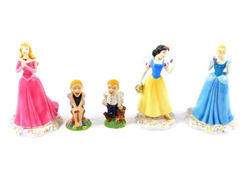 Three Royal Doulton Disney Princesses figures, comprising Sleeping Beauty, Snow White, and Cinderella., together with two Wade Collect It figures, limited edition 2500, comprising Collectus and Collectania, both boxed. (5)