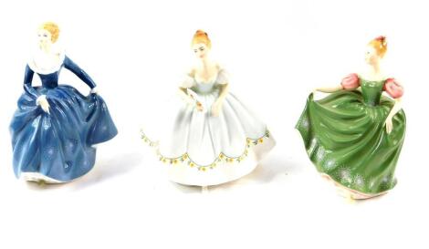 Three Royal Doulton figures, comprising Michele HN2234., Fragrance HN2334., and First Dance HN2803.