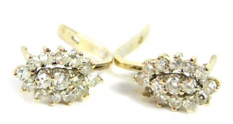 A pair of diamond set oval cluster earrings, set with brilliant cut diamonds in white metal, approx 1ct, 3.0g.