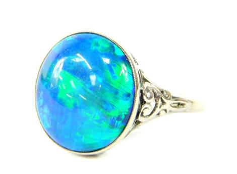 An oval opal doublet set ring, in white metal, stamped 9ct, size O, 3.2g.