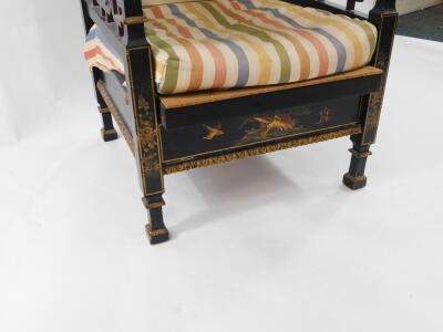 An early 20thC Japanned black lacquer and chinoiserie decorated reclining armchair, with fret work sides and carved cresting rail, 60cm over arms. - 3