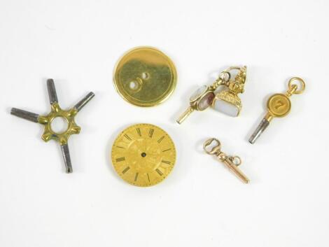 A 19thC Chalcedony fob, triple hard stone set watch key, further watch key and three pocket watch parts.