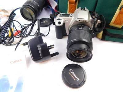 A Canon EOS 300 camera, with a zoom lens, EF28 90mm 1:4-5.6, further Ultrasonic lens, EF75-300mm, and instructions, cased, together with a Samsung digital camcorder, VP-DX100-PAL, boxed. (2) - 2