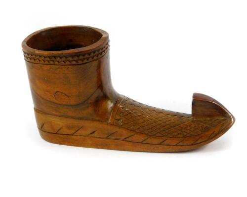 A Yugoslavian treen match holder carved as a boot, 11.5cm wide.