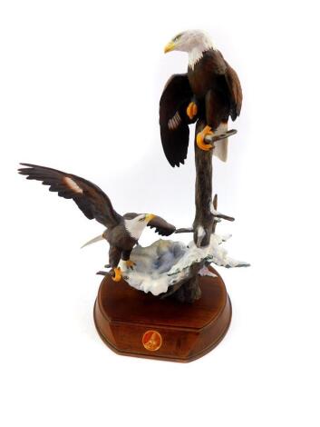 A TFM porcelain sculpture Eagles Forever Free by Ted Blaylock, The Alaska Chilkat Bald Eagle Preserve, with stand, 37cm high.