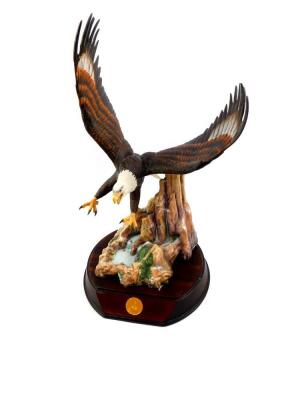 A TFM porcelain sculpture Everlasting Glory, by Ted Blaylock, The Alaska Chilkat Bald Eagle Preserve, with a wooden stand, 39cm high. (AF)