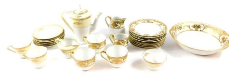 A Noritake porcelain part tea service, decorated in gilt with baskets and other flowers, against a cream border, comprising coffee pot, cream jug, sugar bowl, two further cream jugs, a pair of coffee cups, three tea cups, six saucers and four tea plates, 