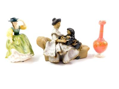 A Royal Doulton figure modelled as Buttercup HN2309, Welsh pottery figure group modelled as a Victorian lady and child seated on a chaise longue, 23cm wide, and a Victorian pink glass bud vase, enamel and gilt decorated with flowers and foliage, gilt heig