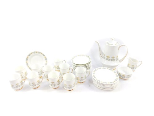 A Paragon porcelain coffee service decorated in the Fiona pattern, comprising coffee pot, cream jug, sugar bowl, ten cups, eleven saucers and ten tea plates.