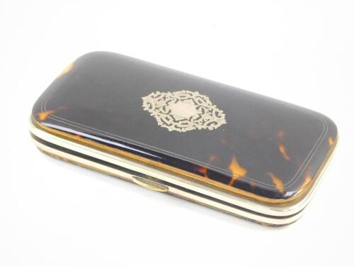 An early 20thC tortoiseshell bound spectacles case, with silver pique decoration, 14cm wide.