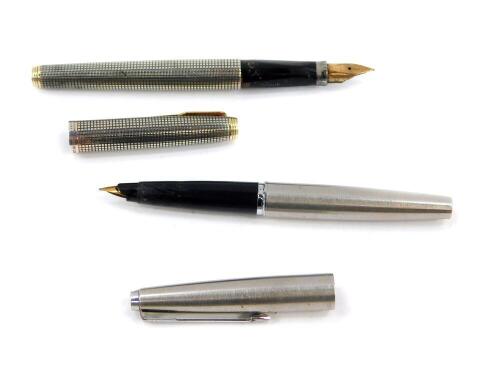 A Parker silver fountain pen, with a 14ct gold nib, and a further Parker fountain pen. (2)