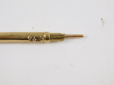 A Victorian propelling pen and pencil, yellow metal with a bloodstone set terminal, together with a silver plated sovereign and half sovereign case, and an oval brass box set to the lid and base with a red agate. (3) - 2